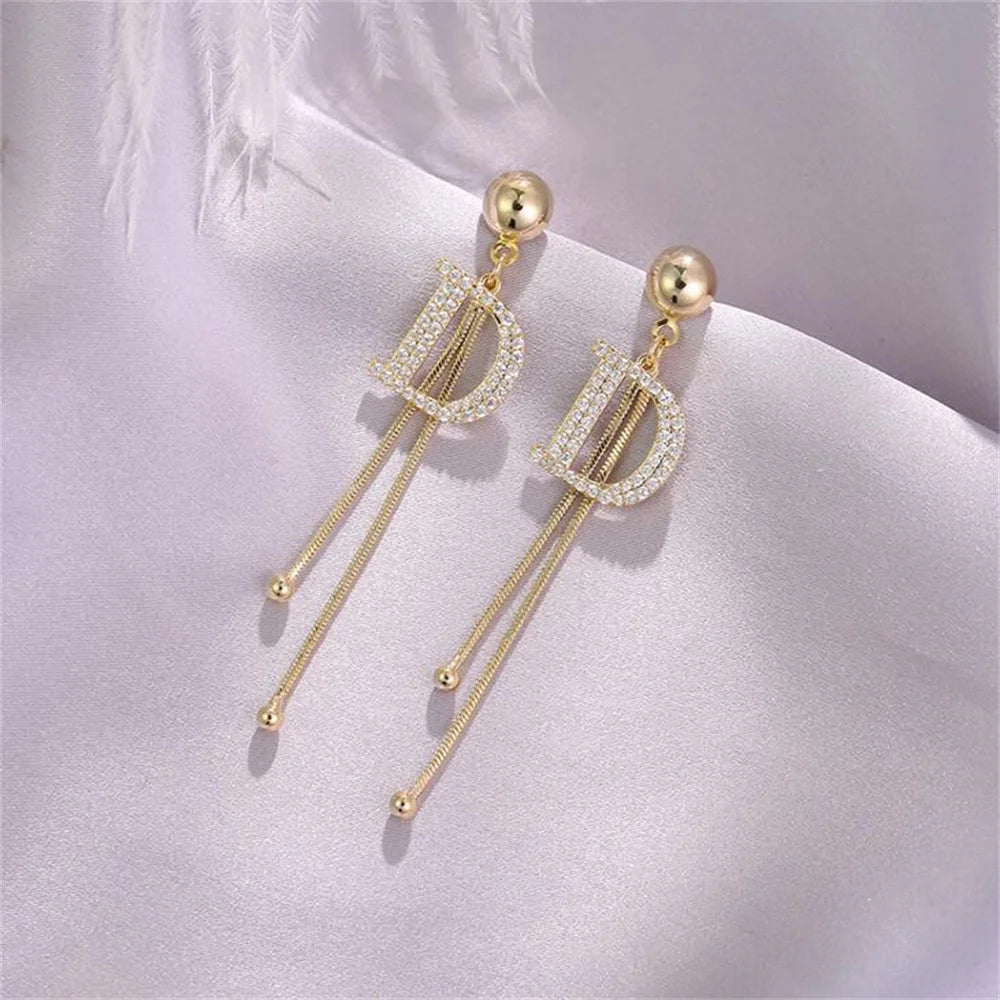 Gold Crystal Letter D Tassel Earrings