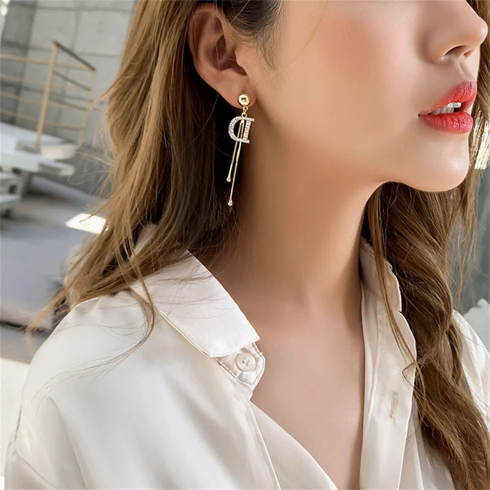 Gold Crystal Letter D Tassel Earrings